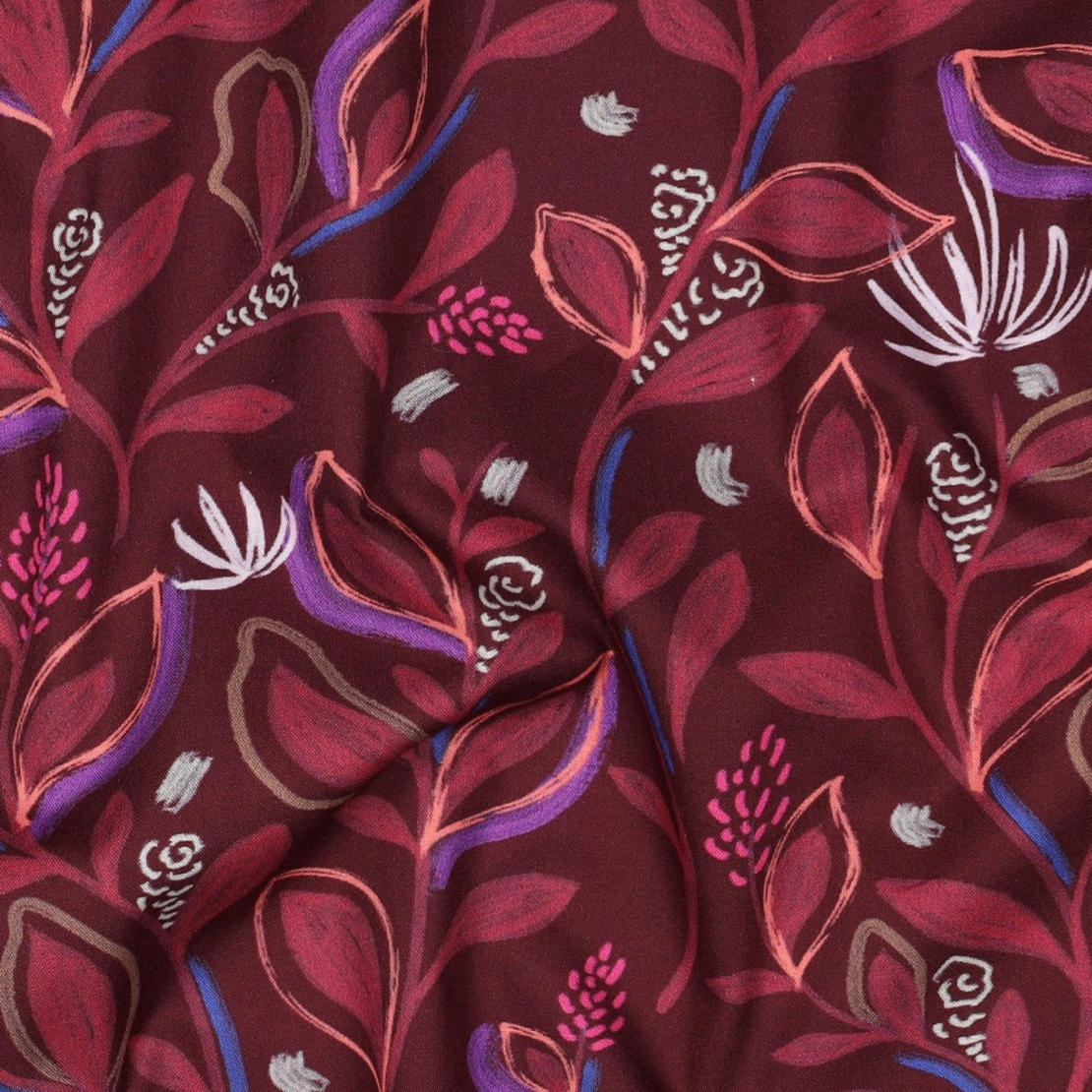 אריג כותנה דפוס עלים דיגיטלי על רקע בורגנדי