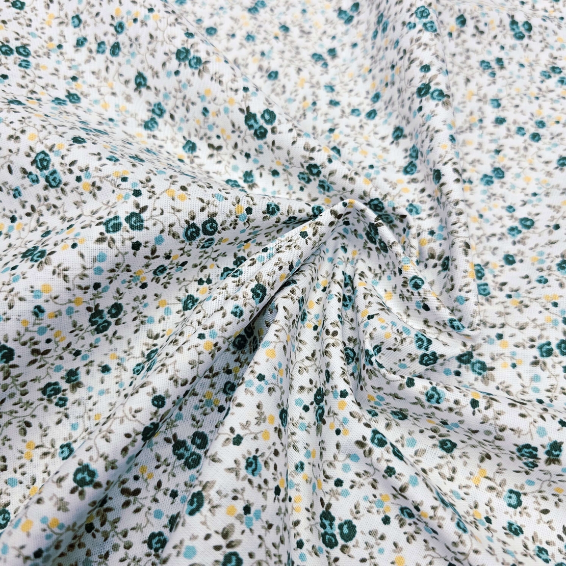 אריג כותנה פרחים קטנים בגווני ירוק דגם שרון