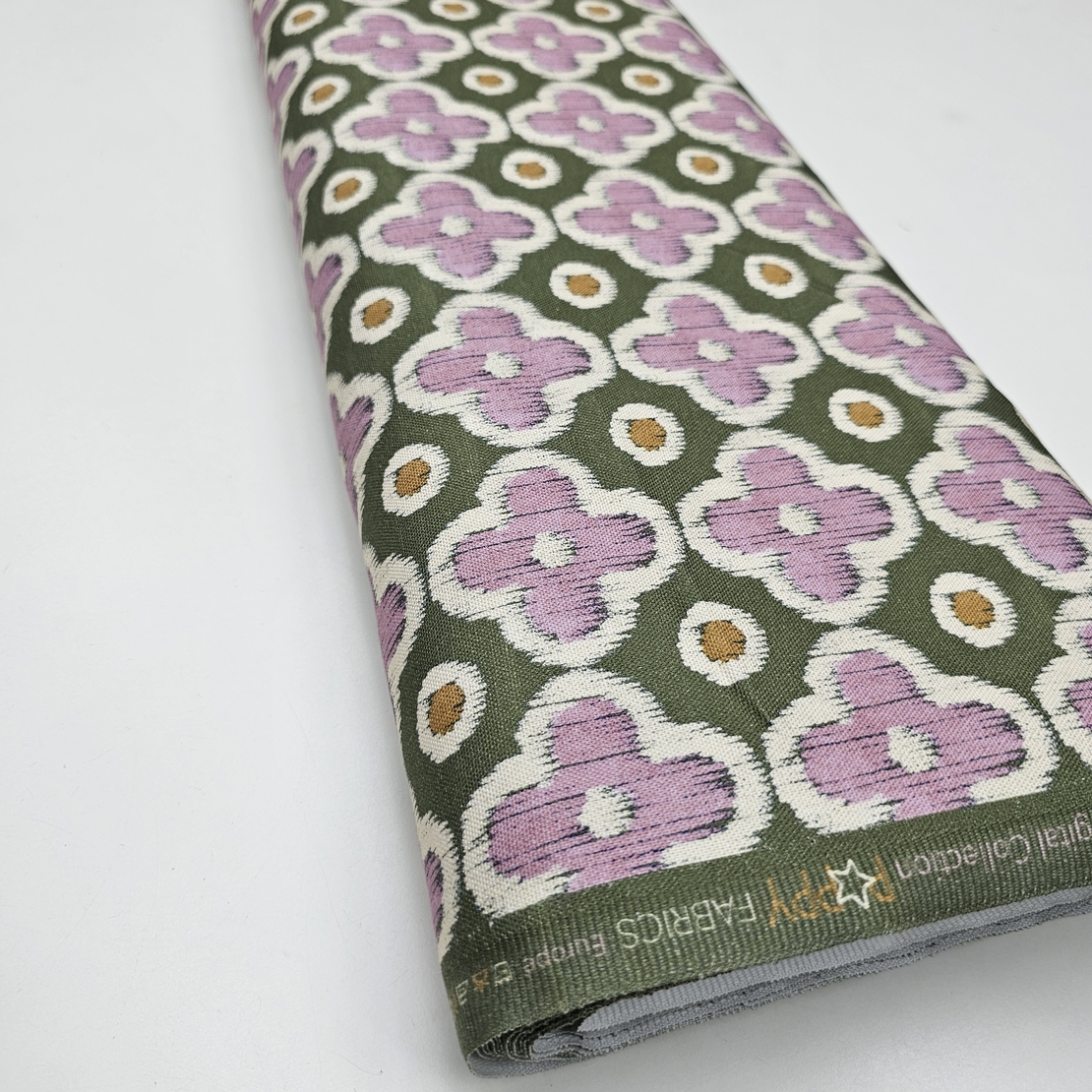 אריג קנבס דפוס פרחים גווני סגול רך וירוק דגם שיר