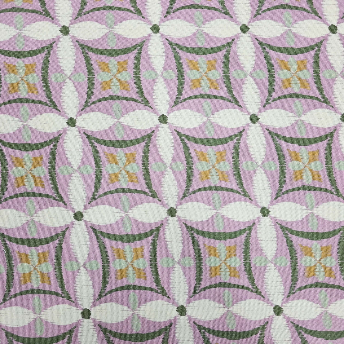 אריג קנבס דפוס פרחים אבסטרקטי גווני ירוק וסגול רך דגם קלודין