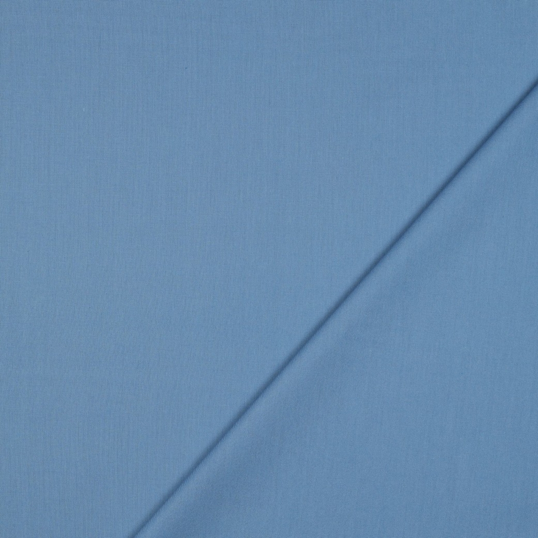 אריג כותנה חלק צבע כחול גינס