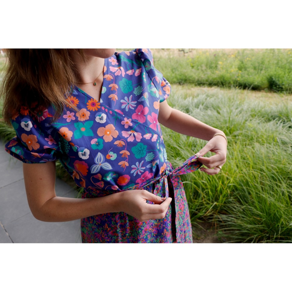 אריג כותנה דפוס מגנוליות על רקע ורוד נרידה הנסן