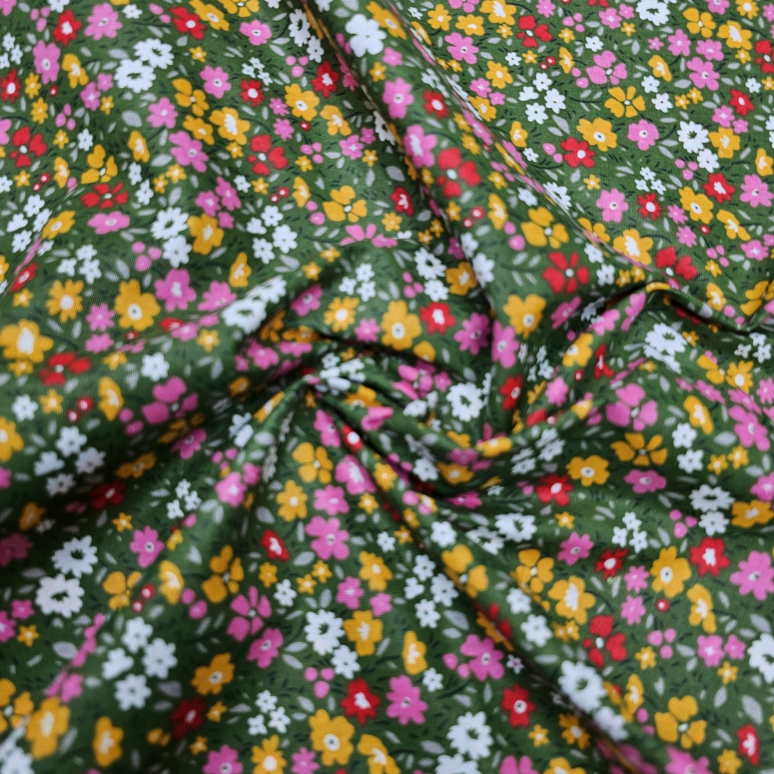 אריג כותנה דפוס פרחים שמחים על רקע ירוק דגם אתי