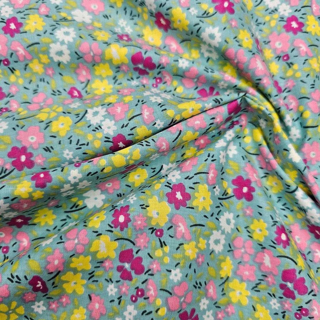 אריג כותנה דפוס פרחים שמחים על רקע טורקיז