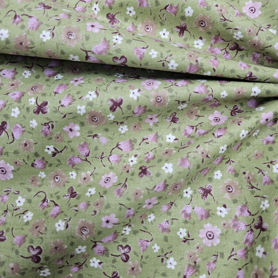 אריג כותנה דפוס פרחי פעמונית קטנים על רקע פיסטוק