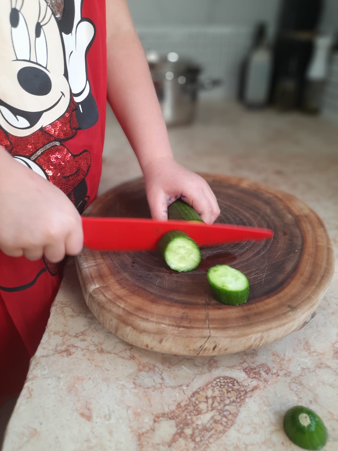 Red chef's knife made of durable and non-toxic plastic