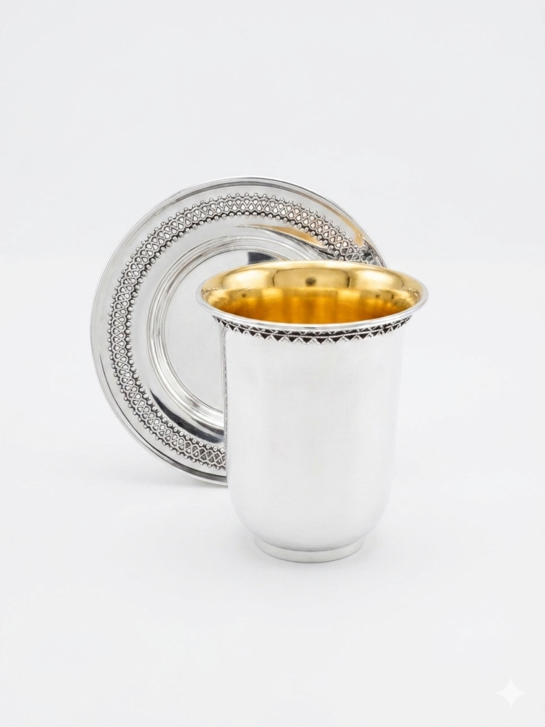 An elegant, handmade Kiddush set with filigree decoration made of pure silver, made in Israel.