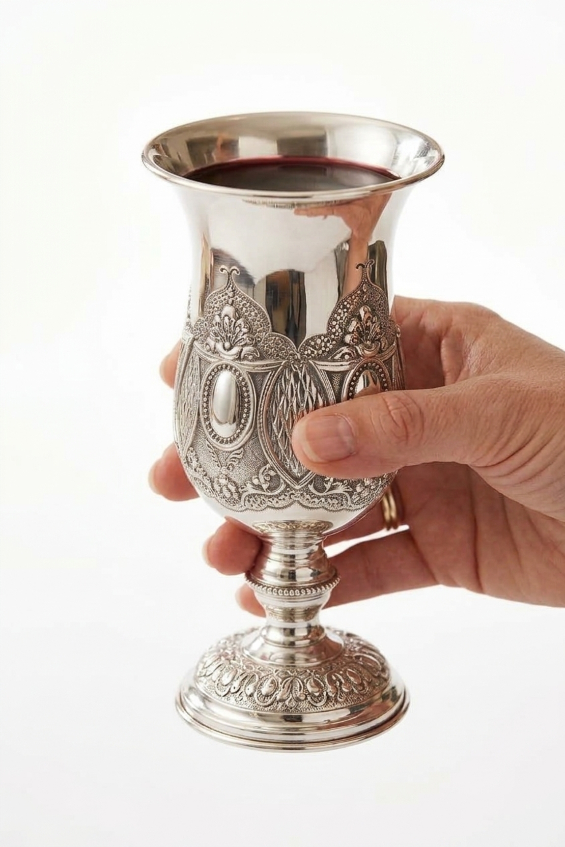 Hand holding a pure silver Kiddush cup – Premium model, 235 ml | Magnificent, ornate Kiddush cup