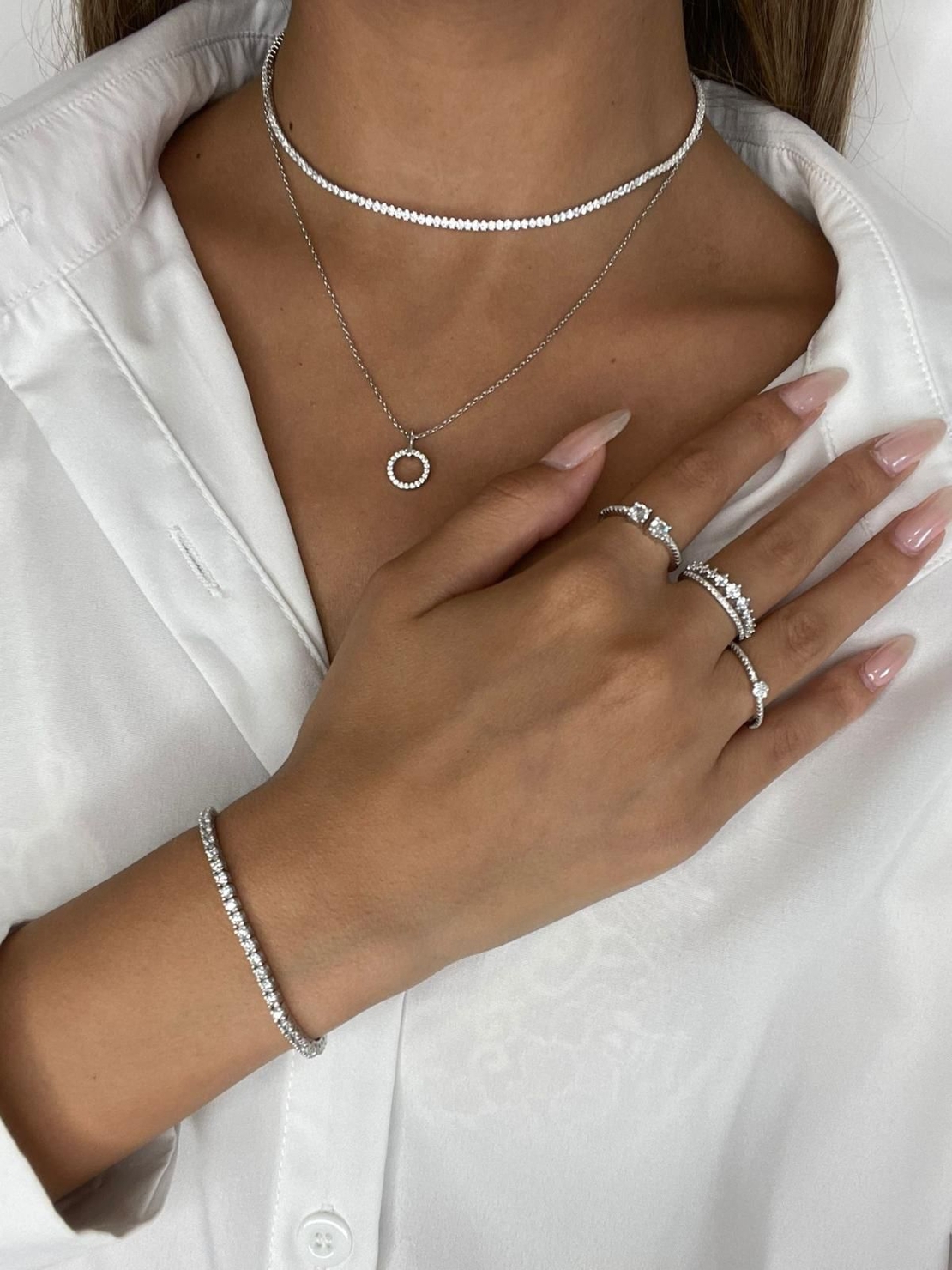 Classic silver tennis bracelet studded with zircons