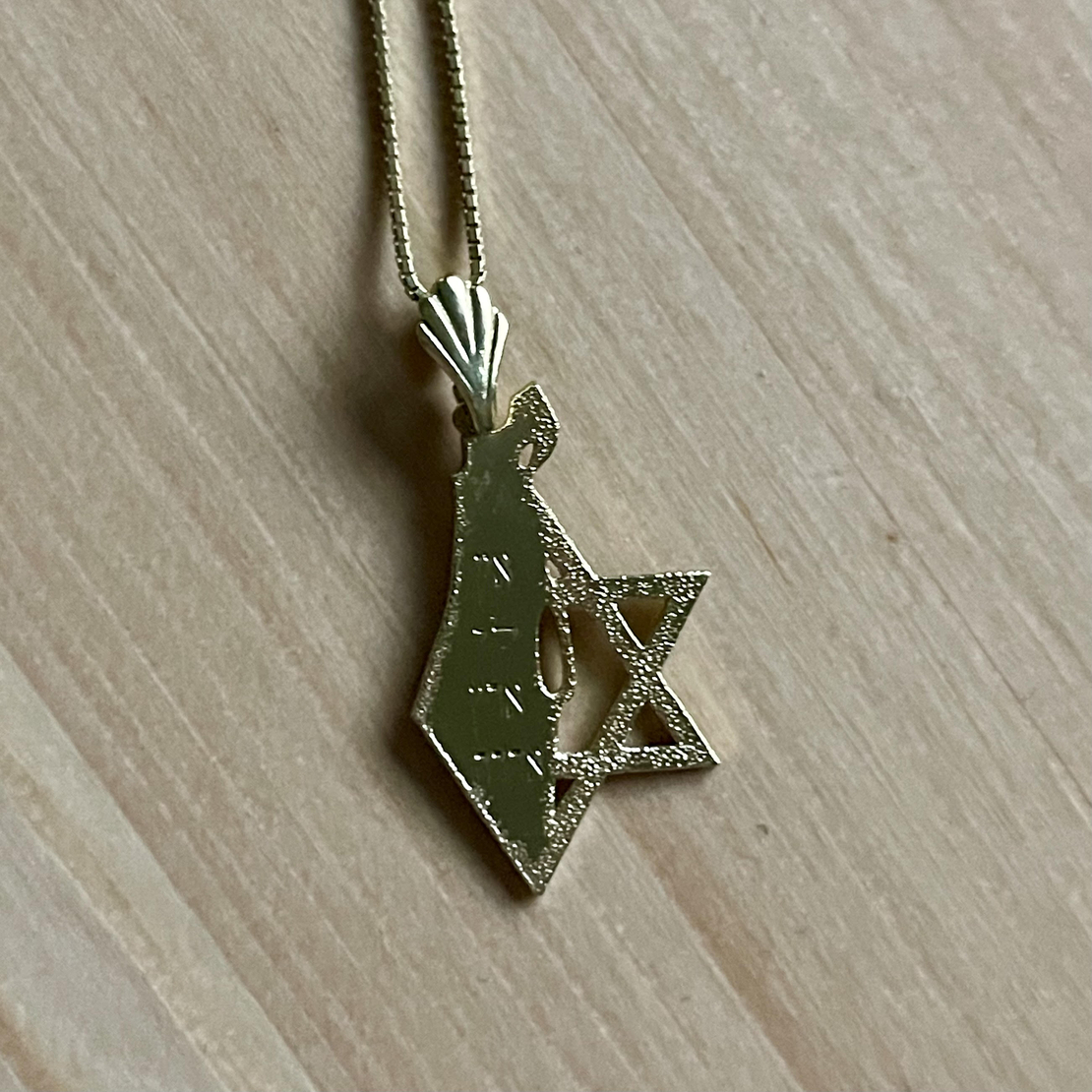 The Land of Israel pendant and half of the Star of David on the outside, silver