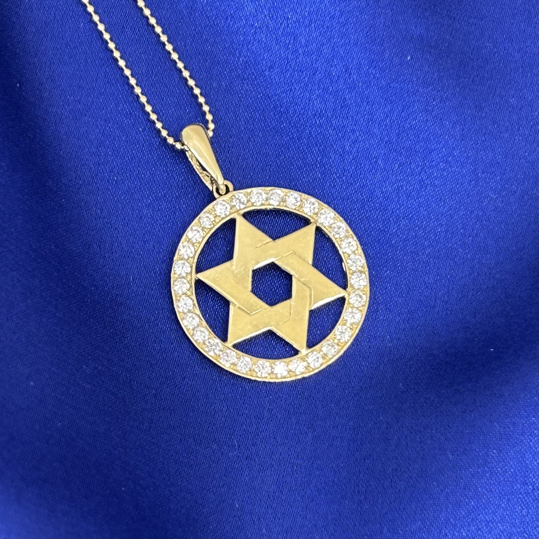 Star of David 14k yellow gold pendant with zircons inlay around