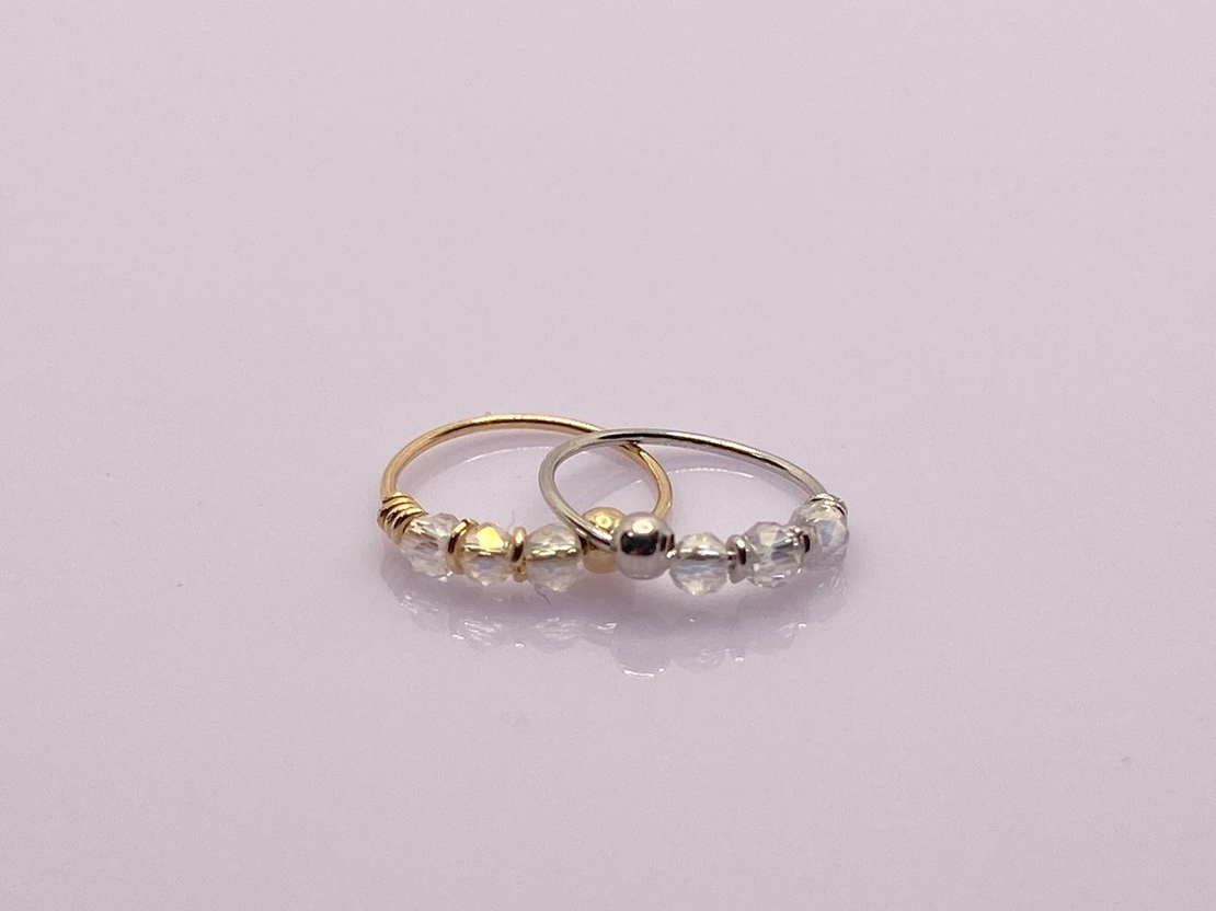 Hoop for piercing with a transparent gemstone - 14K gold