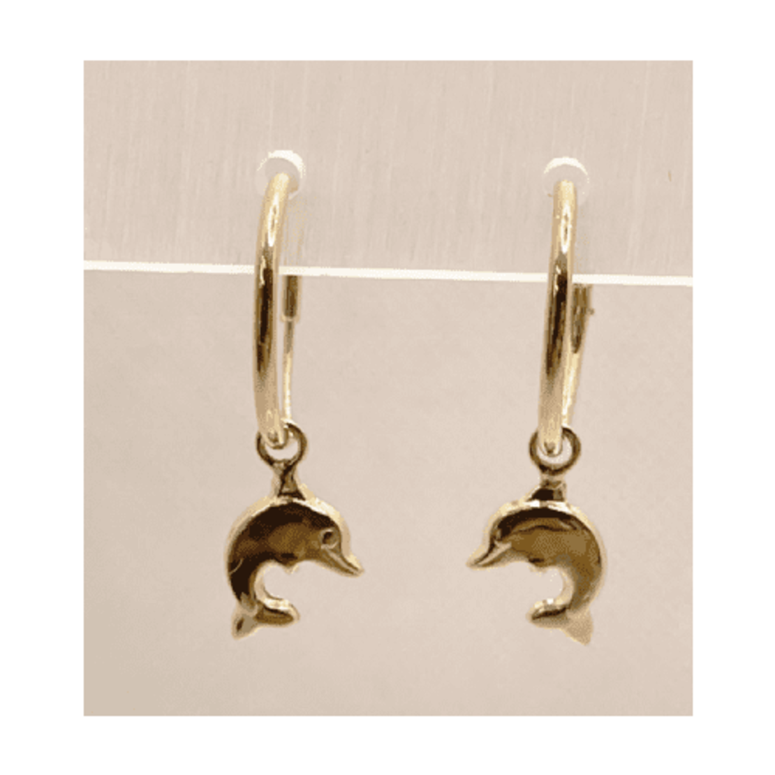 14K gold hoop with dolphin pendant element