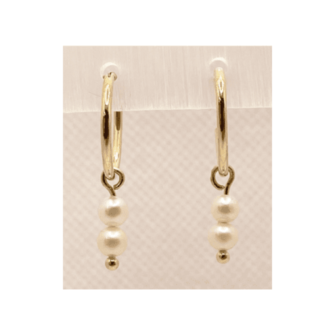 14K gold hoop with a hanging element of 2 pearls