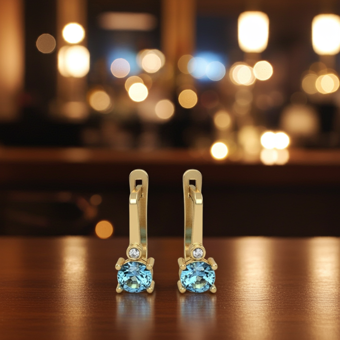Earrings made of 14k gold set with Blue Topaz Suisse stones and diamonds model EAG36