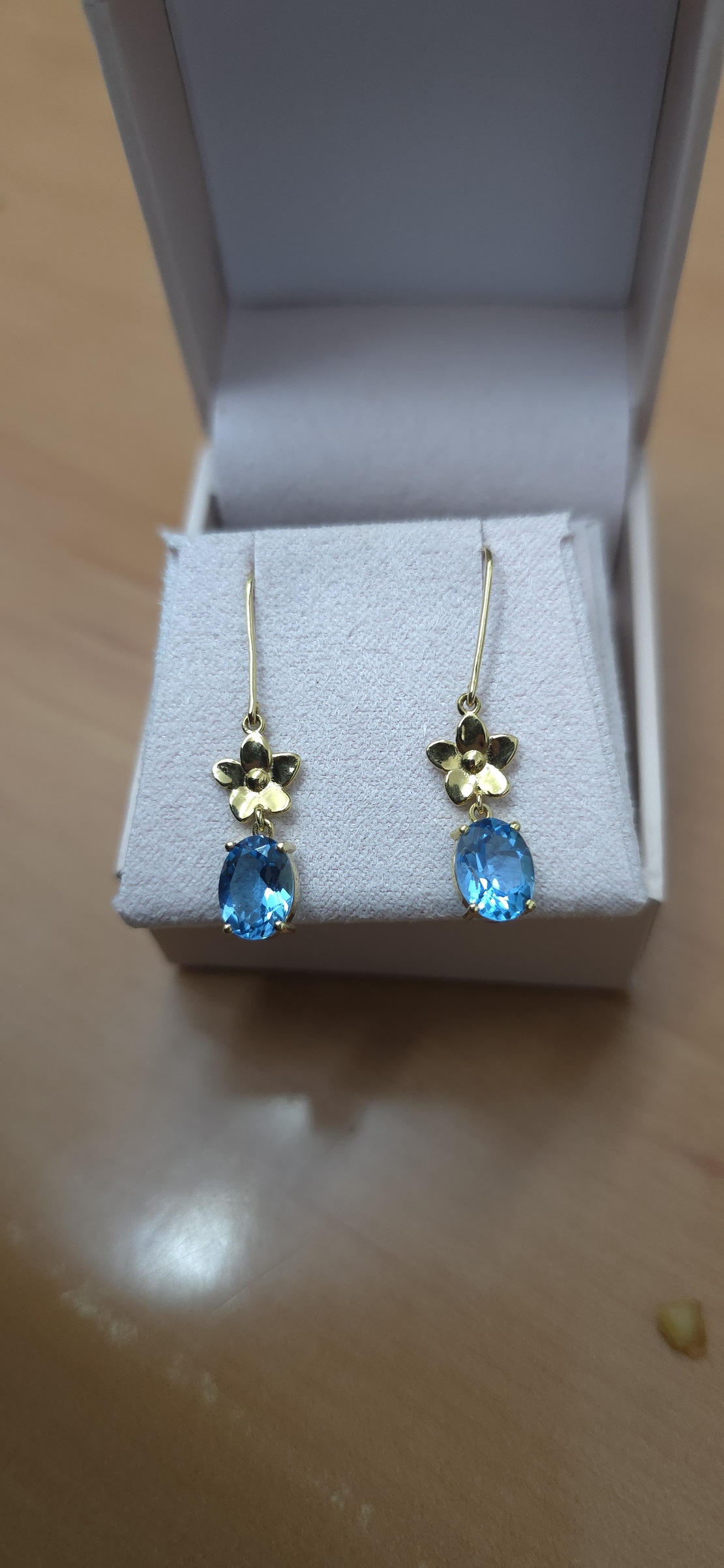 Gold earrings set with Blue Topaz Suisse stones Model EAG16