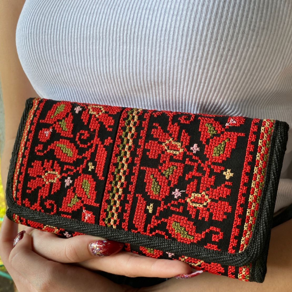 Embroidered purse with red flowers