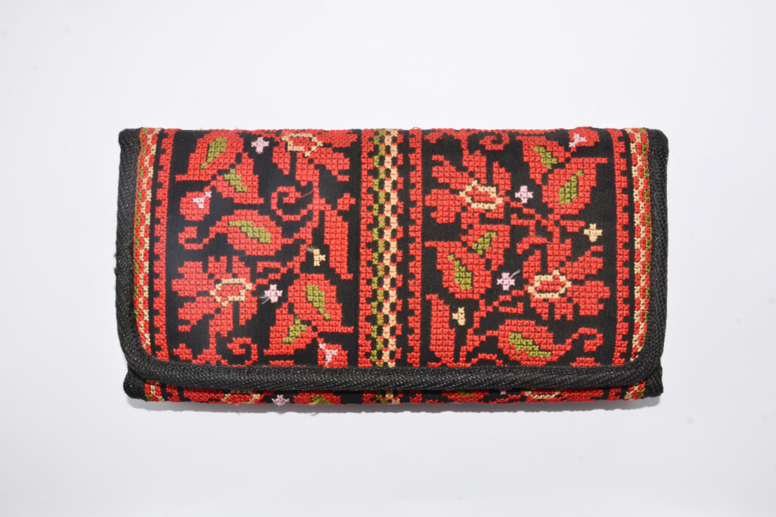 Embroidered purse with red flowers