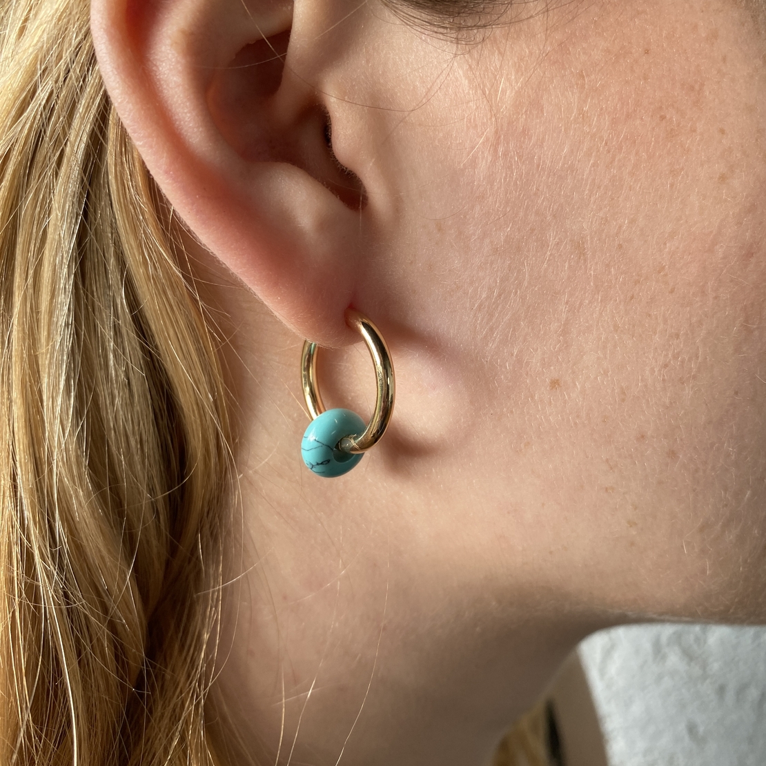 Gold plated hoop earrings with a stone bead - turquoise