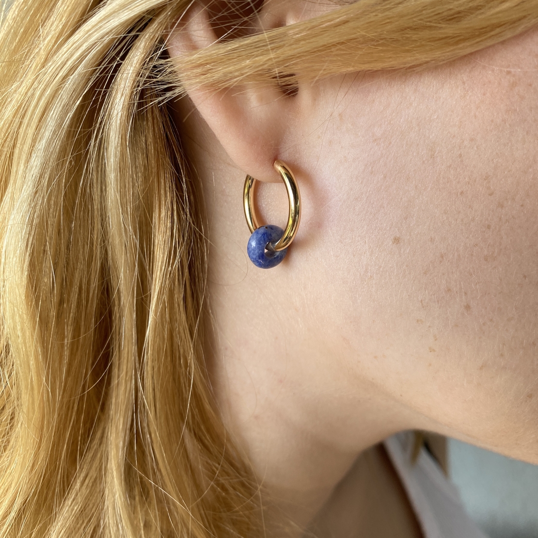 Gold plated hoop earrings with a stone bead - sky blue