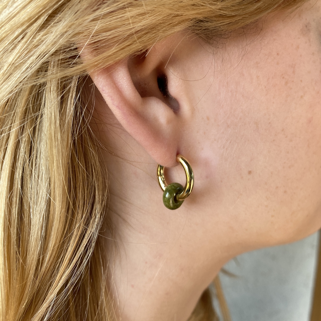 Gold plated hoop earrings with a stone bead - india green