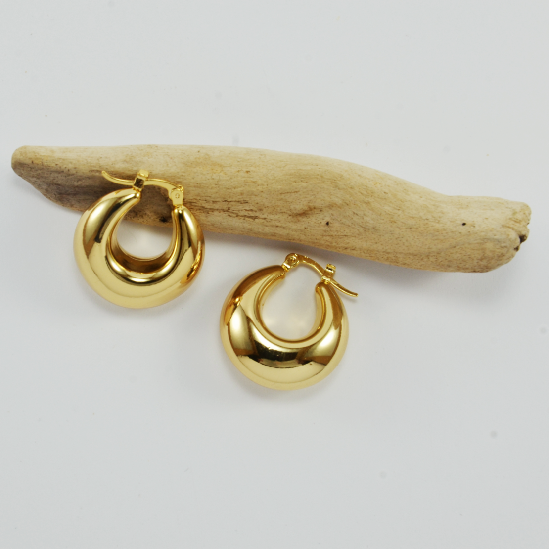 Thick gold hoop earrings