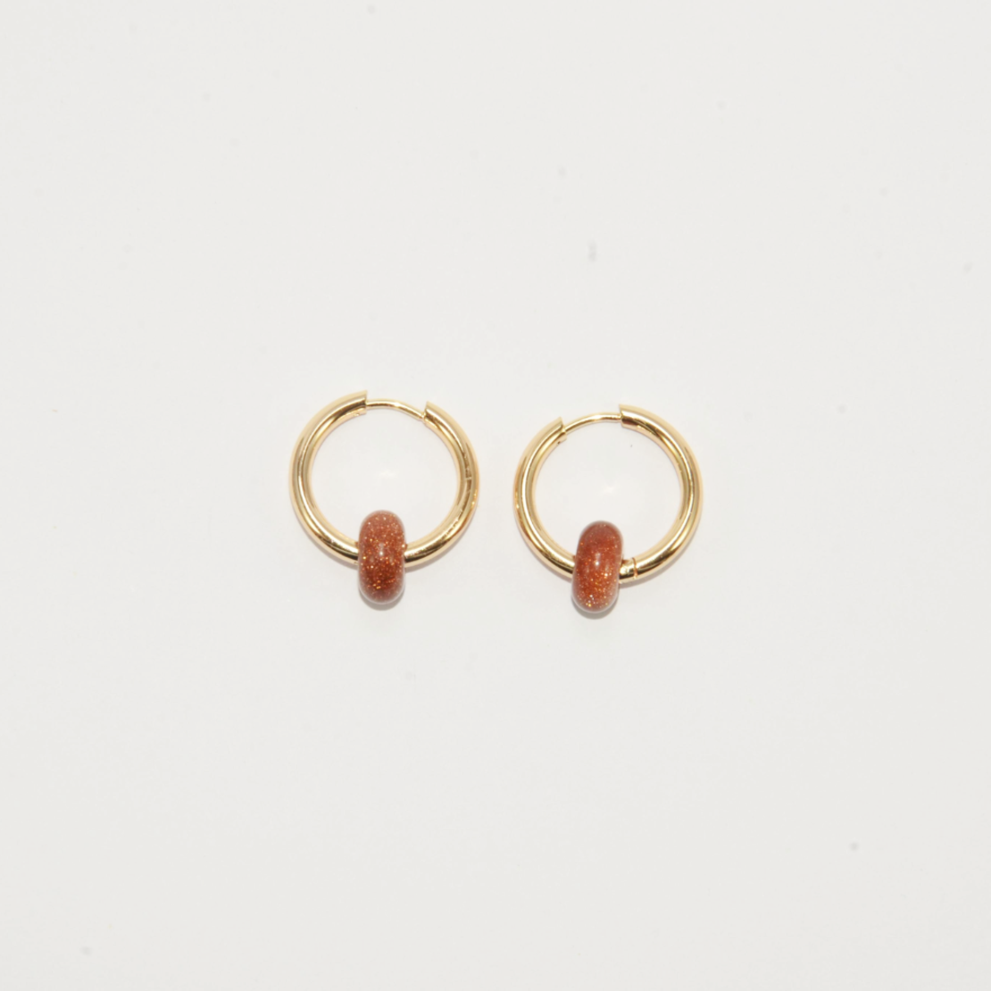 Gold plated hoop earrings with a stone bead - sparkling red