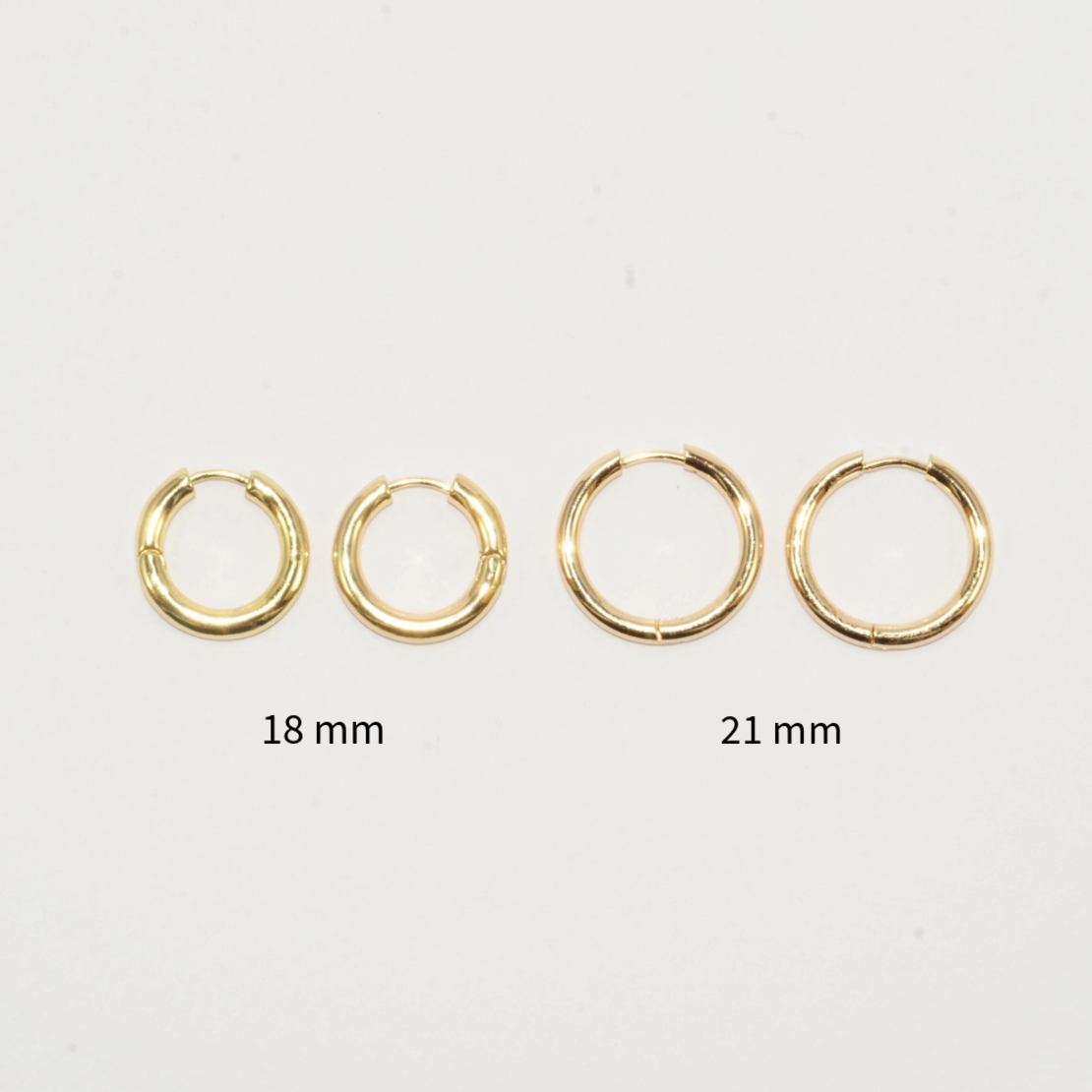 Gold plated hoop earrings with a stone bead - sparkling red