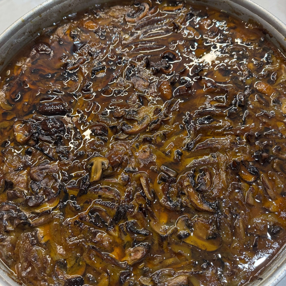 Roast shoulder in a rich mushroom sauce