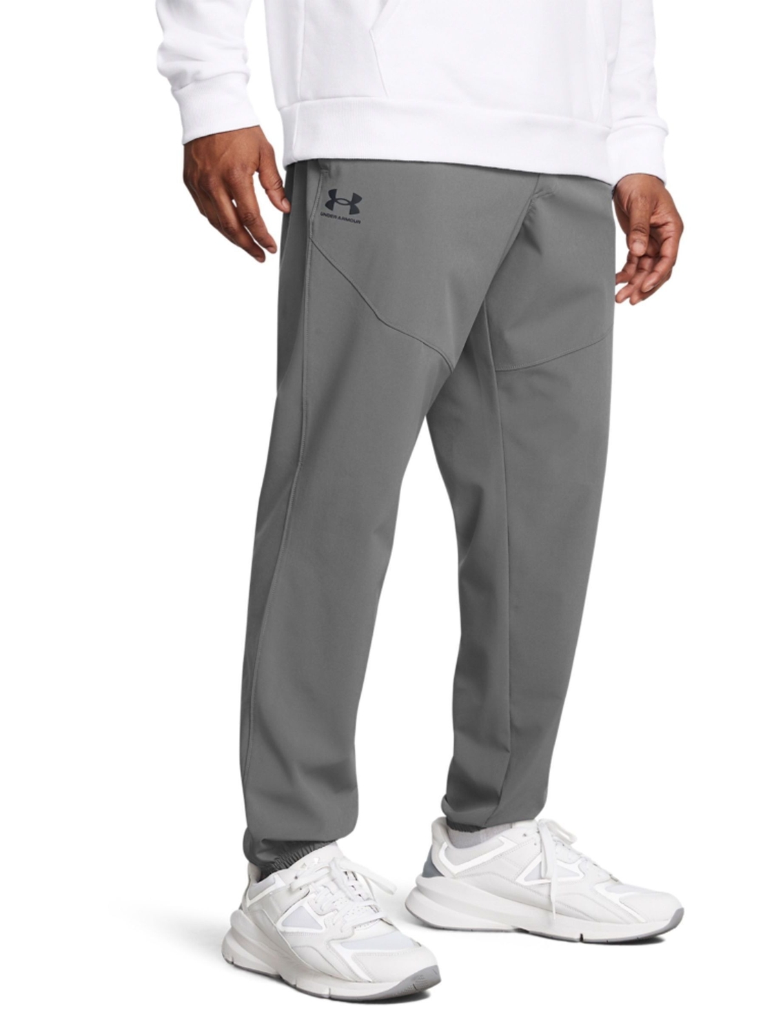 UNDER ARMOUR - מכנסי טרנינג ארוגים בצבע אפור