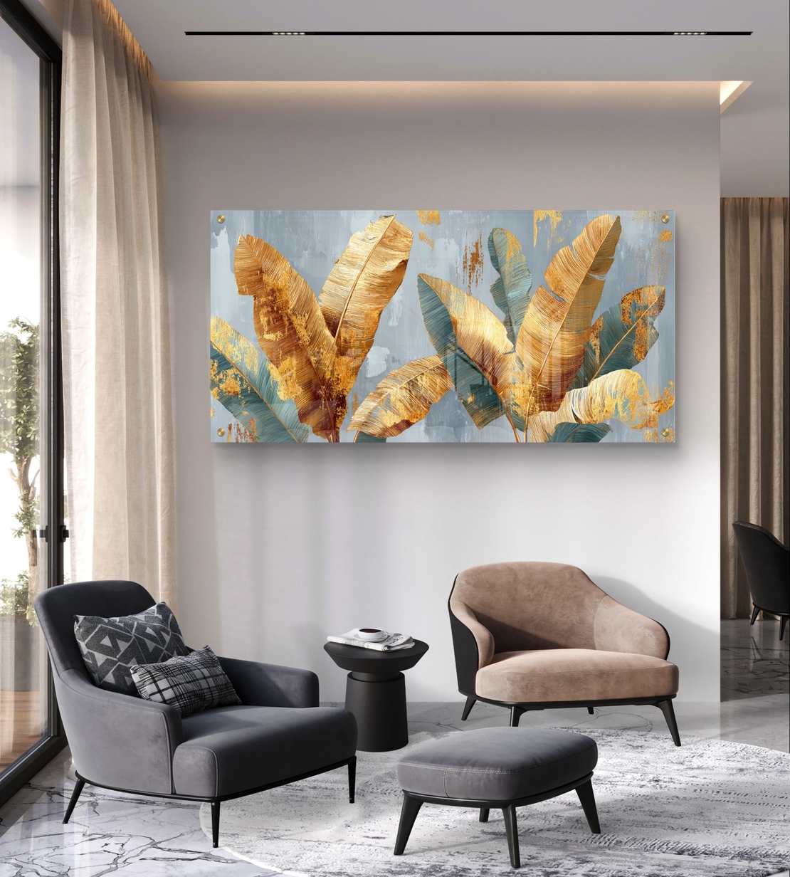 תמונת זכוכית לרוחב עם עלי בננה זהובים וטורקיז על רקע אפור-כחלחל בעיצוב מודרני יוקרתי