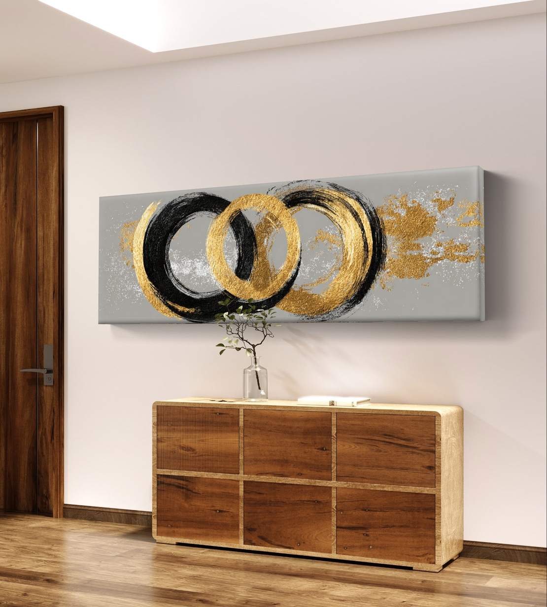תמונת קנבס פנורמית אבסטרקטית עם מעגלים בגווני שחור וזהב על רקע אפור בעיצוב מודרני ויוקרתי