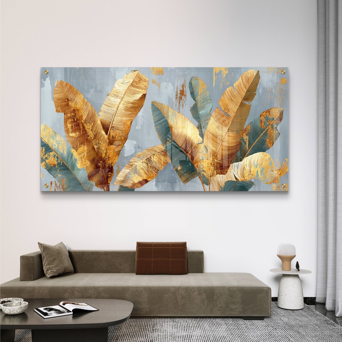 תמונת זכוכית לרוחב עם עלי בננה זהובים וטורקיז על רקע אפור-כחלחל בעיצוב מודרני יוקרתי