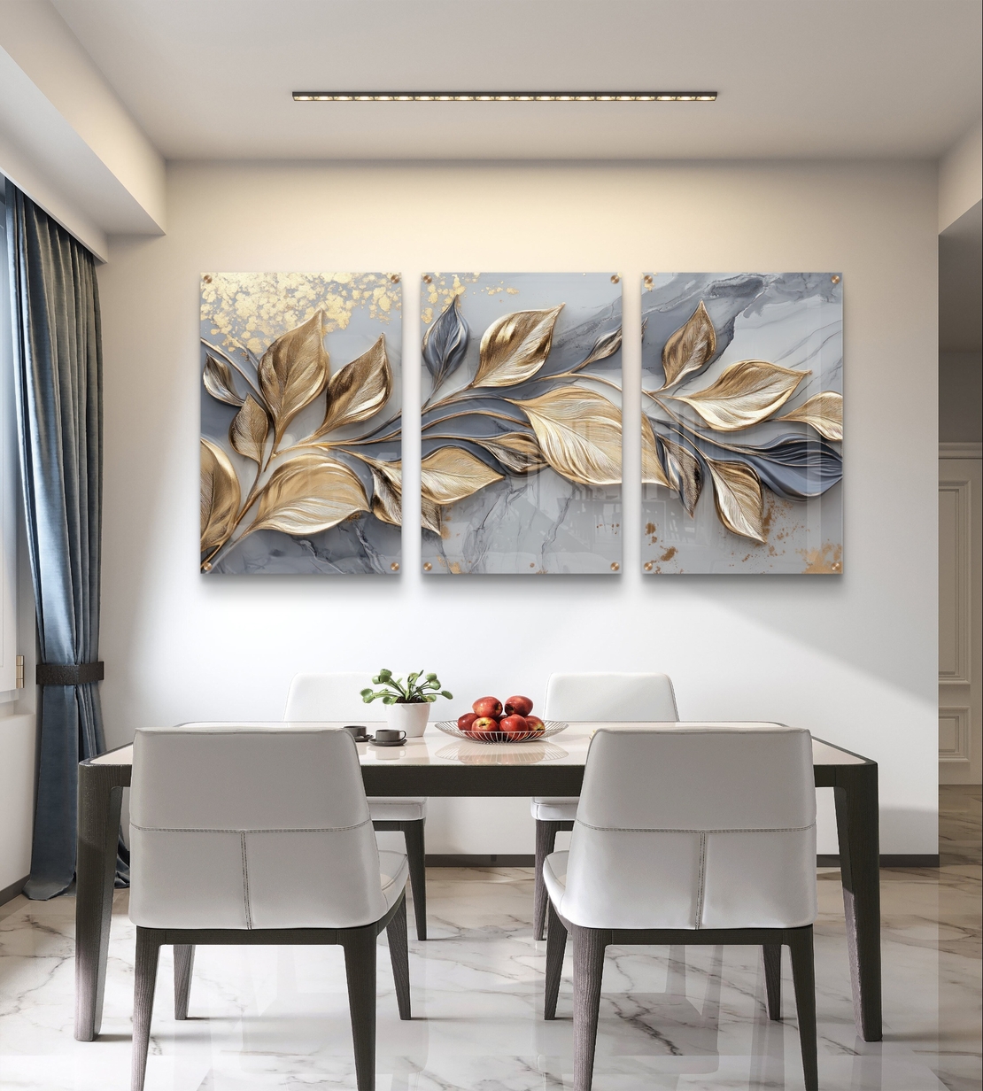 שלישיית תמונות זכוכית עם עלים מוזהבים בתנועה על רקע שיש אפור בעיצוב יוקרתי