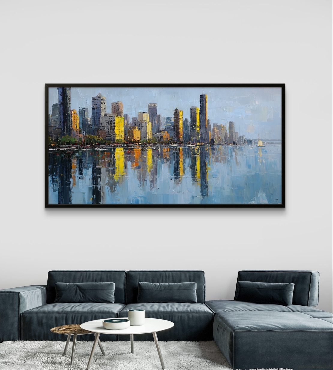 תמונת קנבס לרוחב של קו רקיע עירוני עם השתקפות במים בגווני כחול וזהב, לעיצוב סלון מודרני ואלגנטי