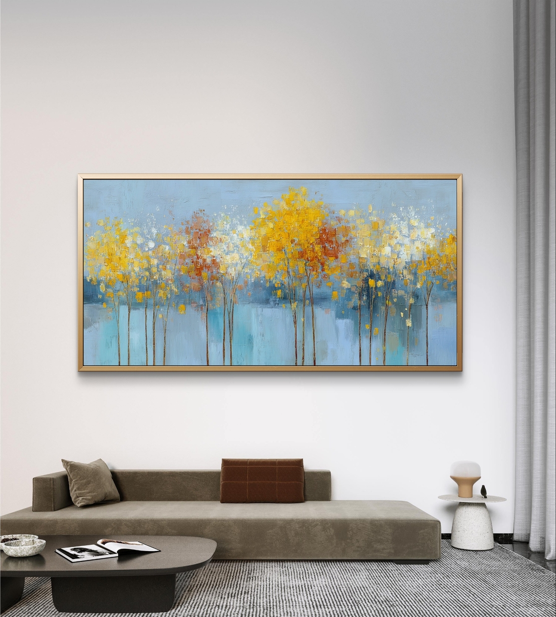 תמונת קנבס של עצים עדינים בגווני תכלת, צהוב ולבן על רקע בהיר