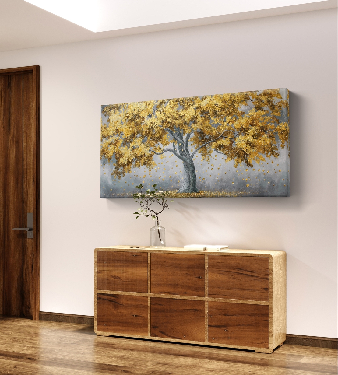 תמונת קנבס לרוחב עם עץ מוזהב ועלים נושרים בעיצוב אלגנטי על רקע רגוע, להוספת יוקרה וחום לסלון.