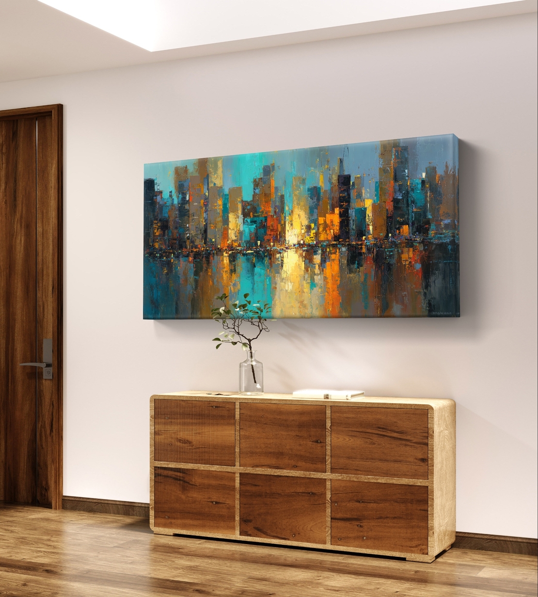 תמונת קנבס אבסטרקטית לרוחב עם קו רקיע עירוני והשתקפות מים בגווני כחול, טורקיז וזהב
