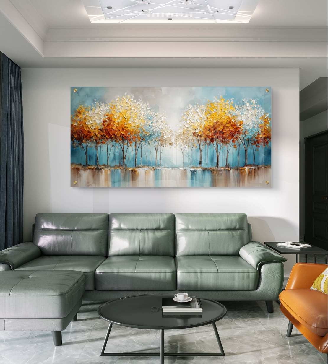 תמונת זכוכית לרוחב עם שדרת עצים בגווני תכלת וזהב המשתקפים במים, בהדפסה חלקה לעיצוב קיר יוקרתי ומרגיע.