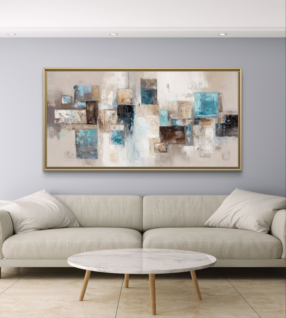 תמונת קנבס לרוחב בעיצוב אבסטרקטי עם צורות גאומטריות בגווני תכלת, בז’ ושמנת