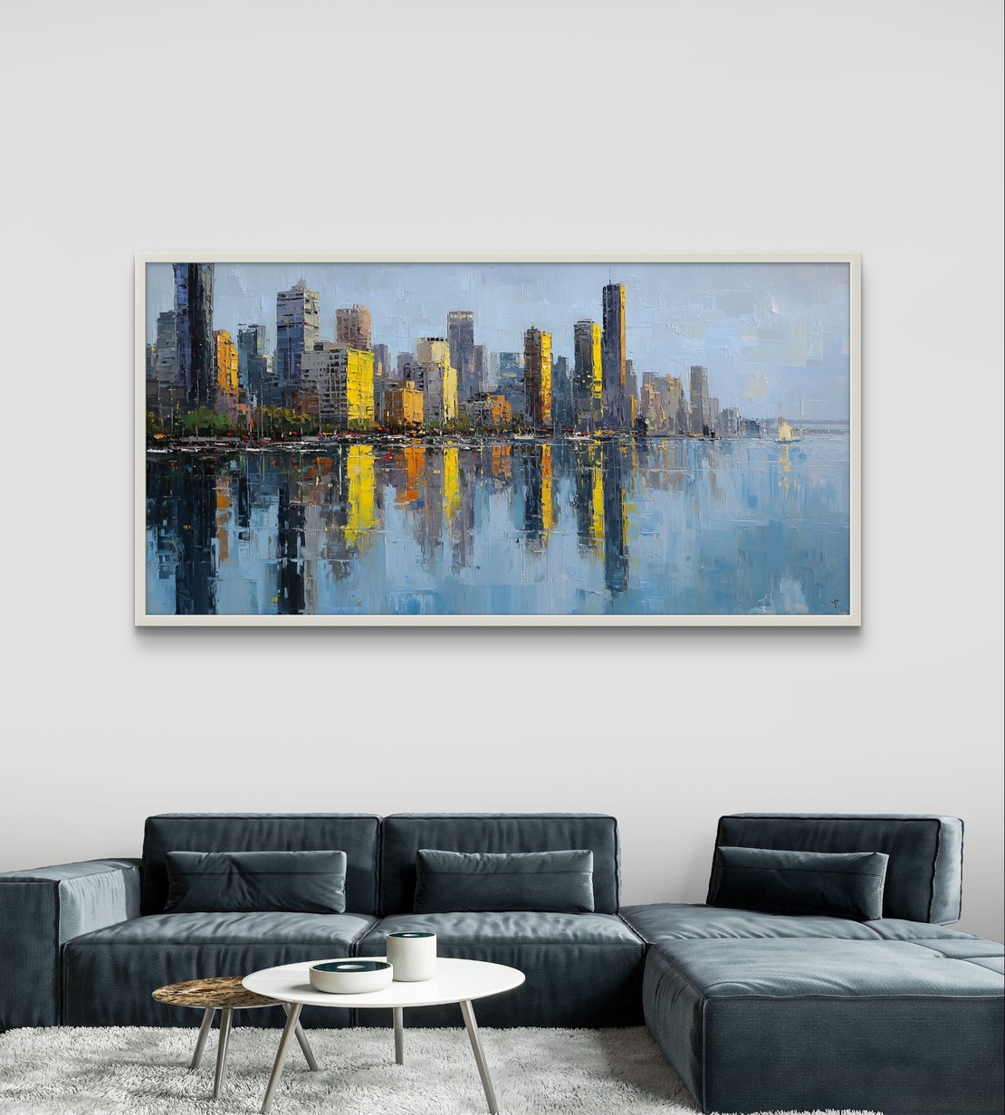 תמונת קנבס לרוחב של קו רקיע עירוני עם השתקפות במים בגווני כחול וזהב, לעיצוב סלון מודרני ואלגנטי