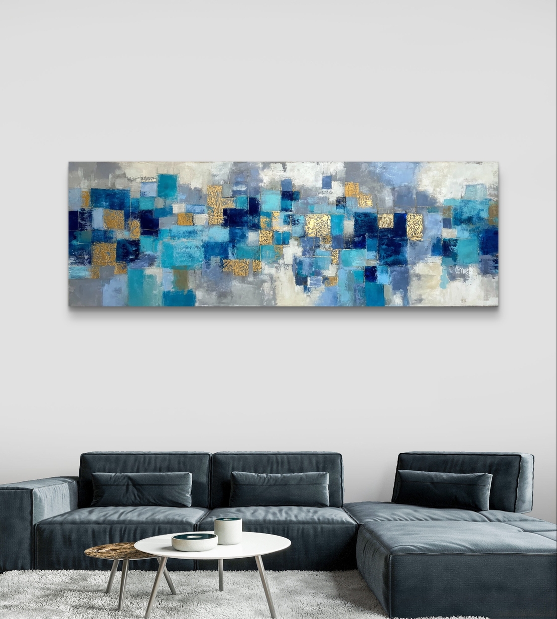 תמונת קנבס פנורמית מופשטת בגווני כחול וטורקיז עם נגיעות זהב – תכשיט לבית