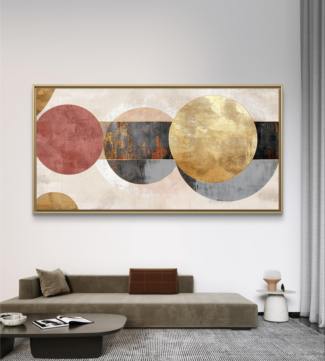 תמונת קנבס לרוחב בעיצוב אבסטרקטי עם מעגלים חופפים בגווני שמנת, זהב ואפור על רקע בהיר.