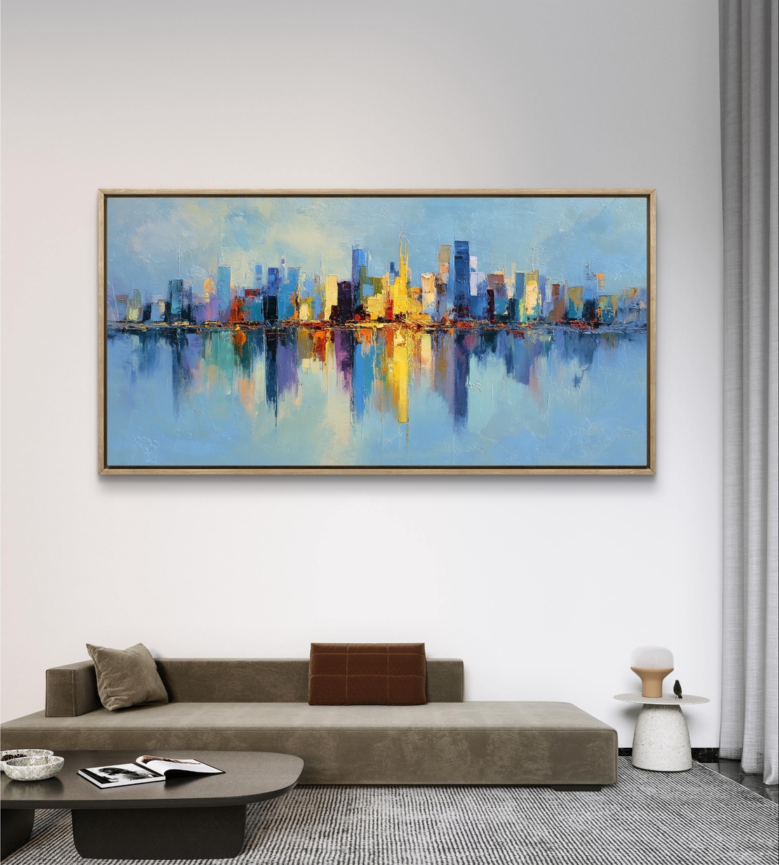 תמונת קנבס לרוחב עם קו רקיע עירוני צבעוני והשתקפות במים בעיצוב מודרני