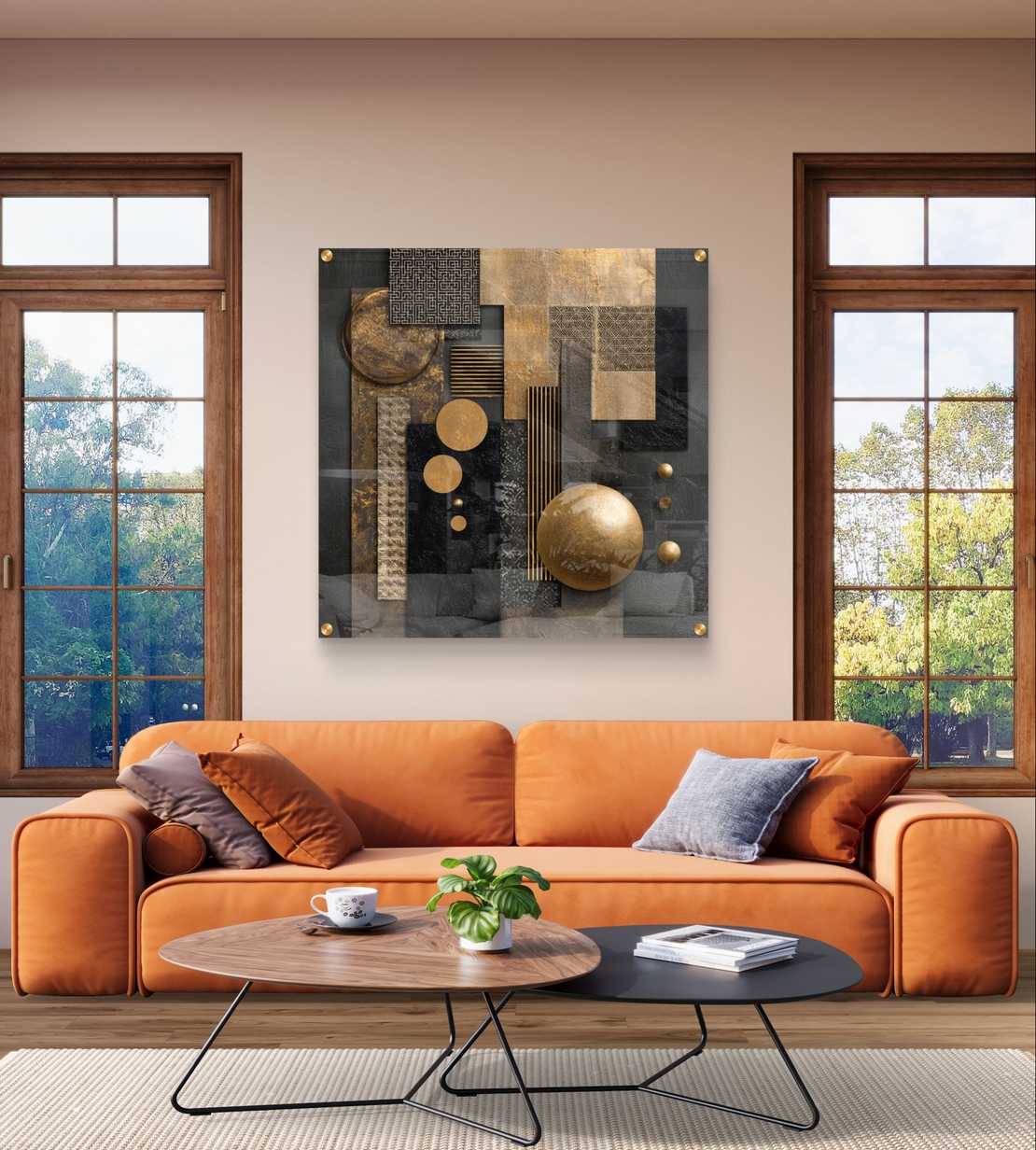 תמונת זכוכית מרובעת בעיצוב אבסטרקט גאומטרי בגווני שחור וזהב עם אלמנטים עגולים ומלבניים