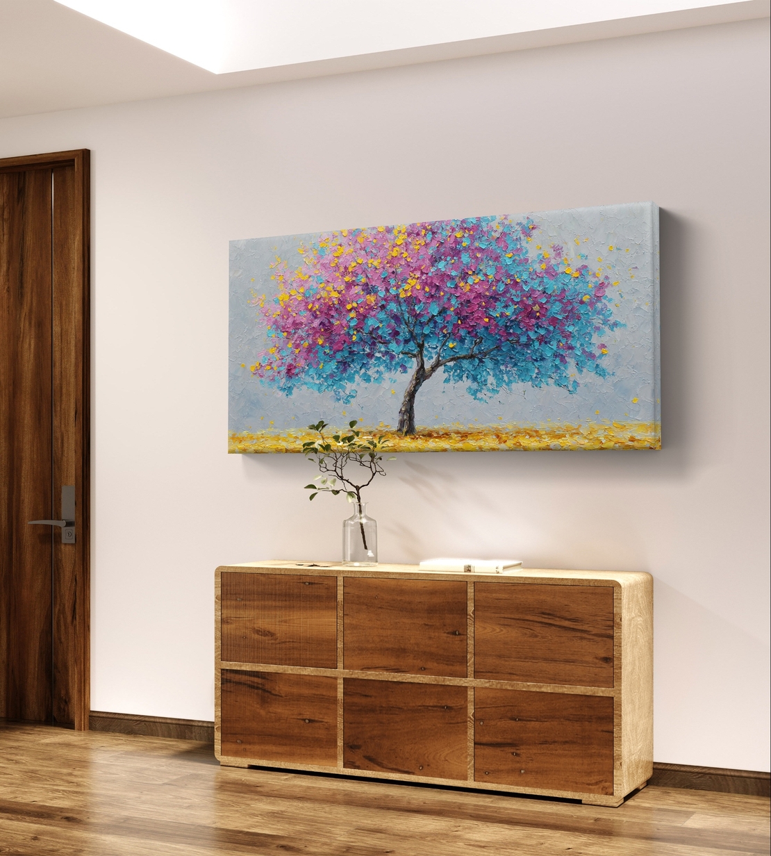 תמונת קנבס לרוחב של עץ פורח בצבעי ורוד ותכלת בסגנון אומנותי לעיצוב הבית