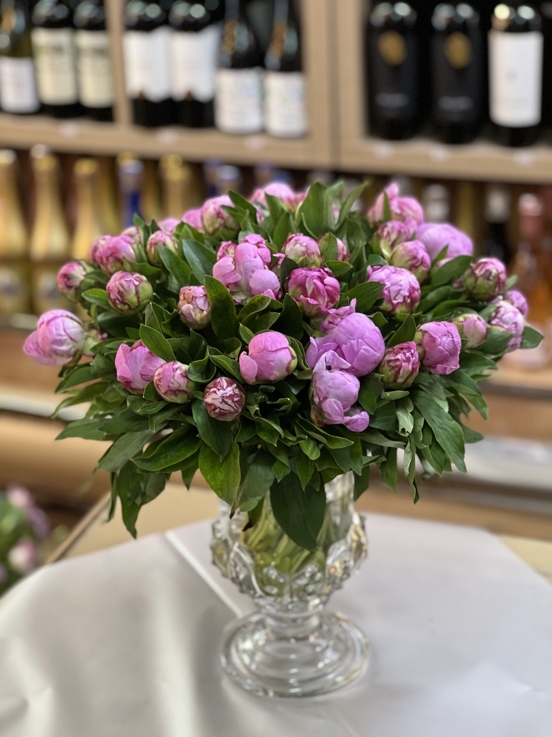 Arrangement of 39 peonies in a vase