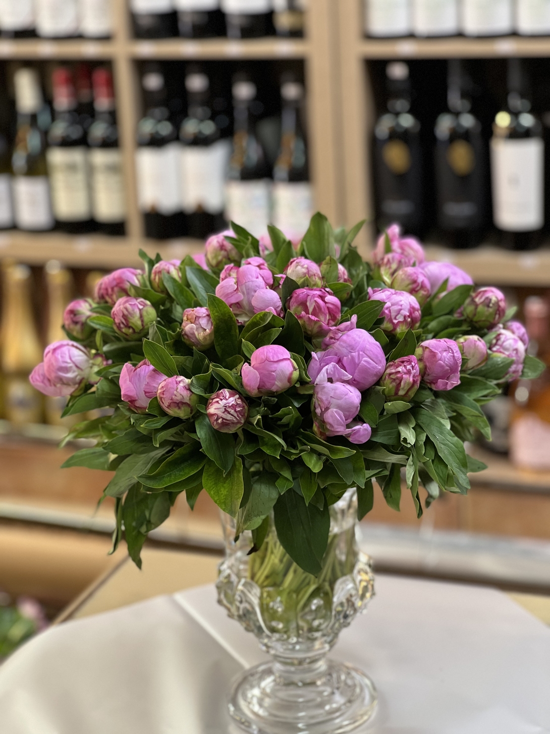 Arrangement of 39 peonies in a vase