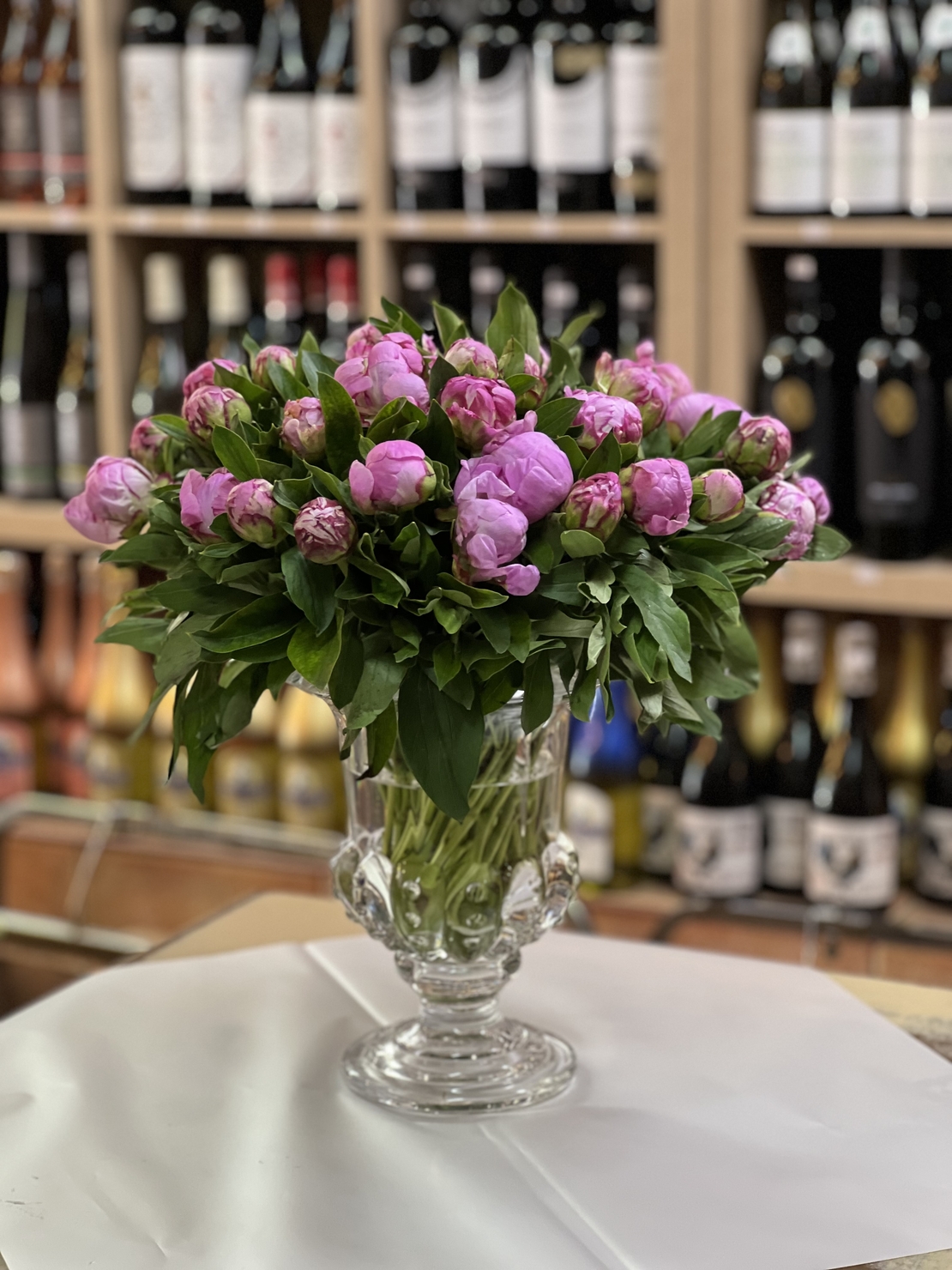 Arrangement of 39 peonies in a vase