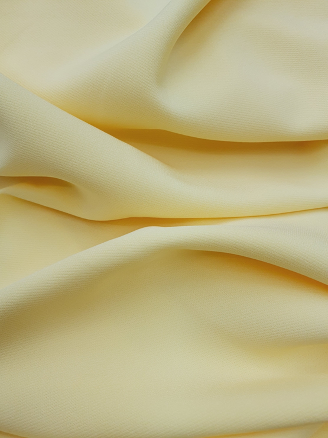 אריג קרפ לייקרה צהוב בננה דגם קומו